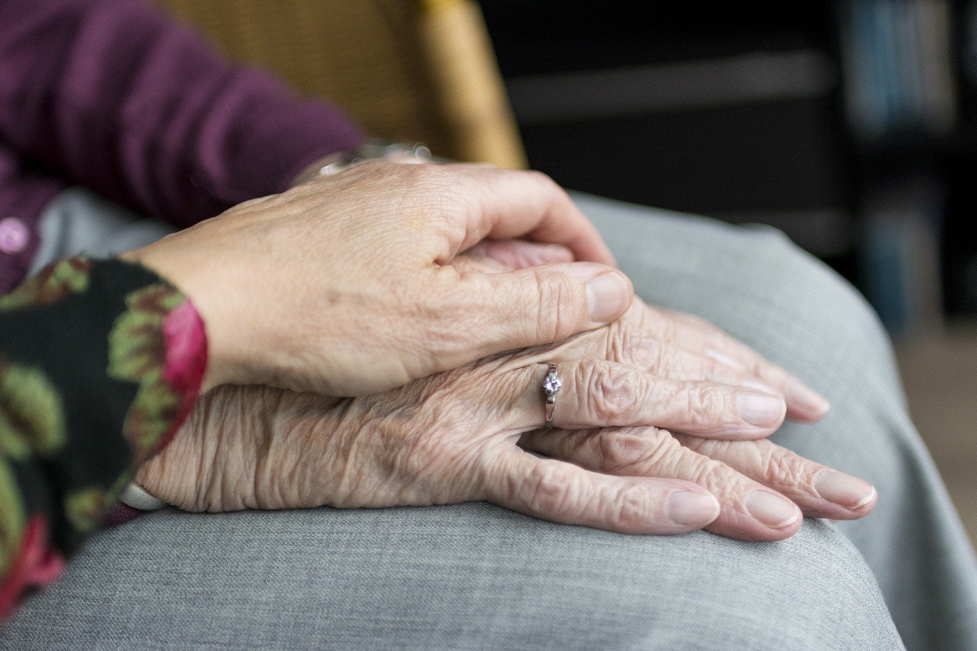 elderly hand holding