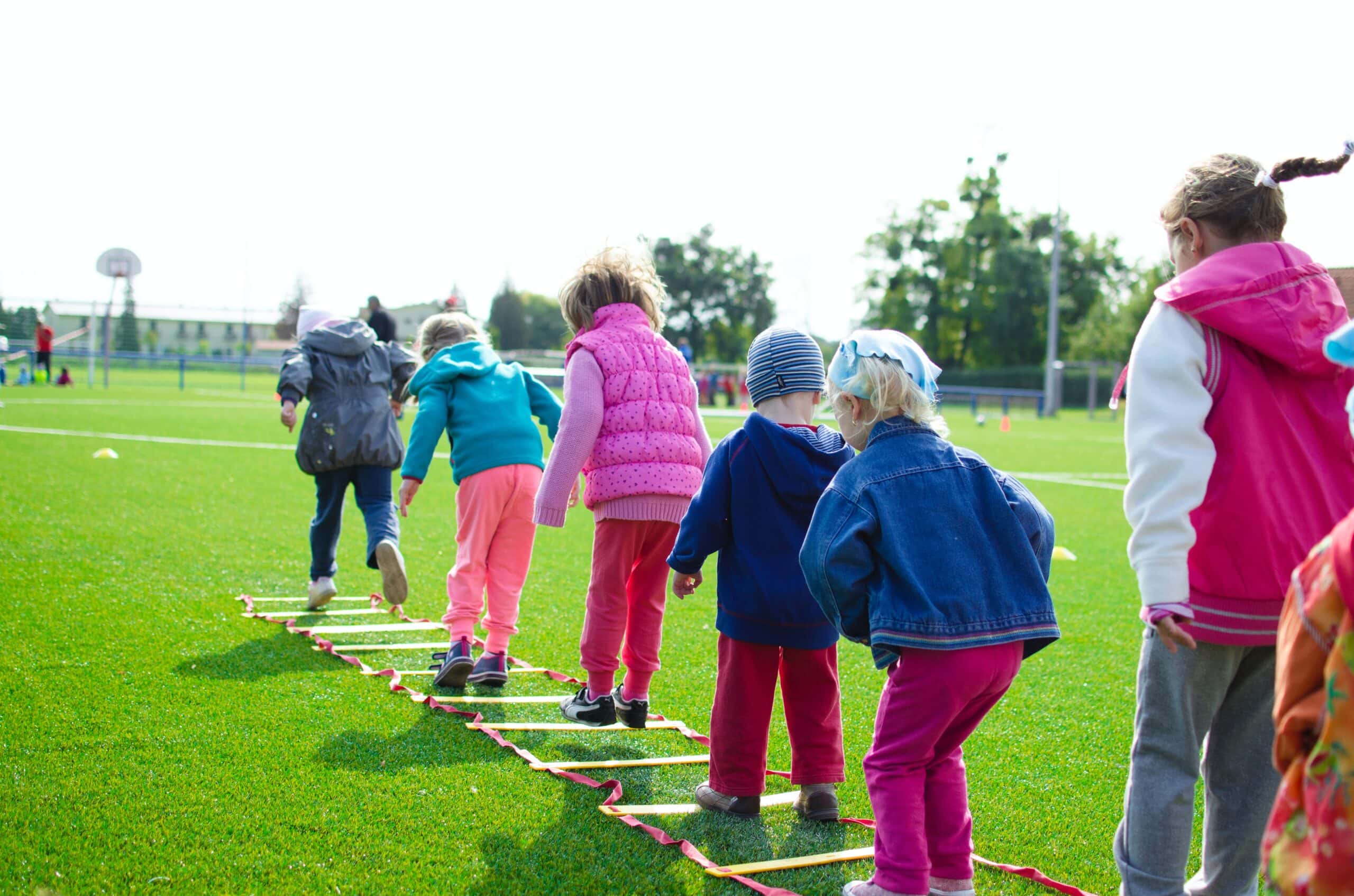 young kids playing hopscotch