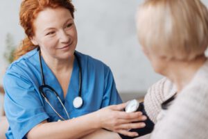 nurse checking blood pressure